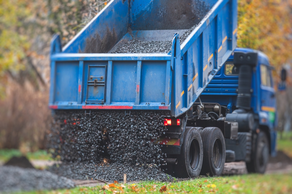 Dump,Truck,,Tractor,And,Bulldozer,Unloading,Gravel,,Road,Metal,,Rubble