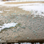 Ground,Level,Closeup,View,Of,Rock,Salt,Ice-melt,On,Concrete
