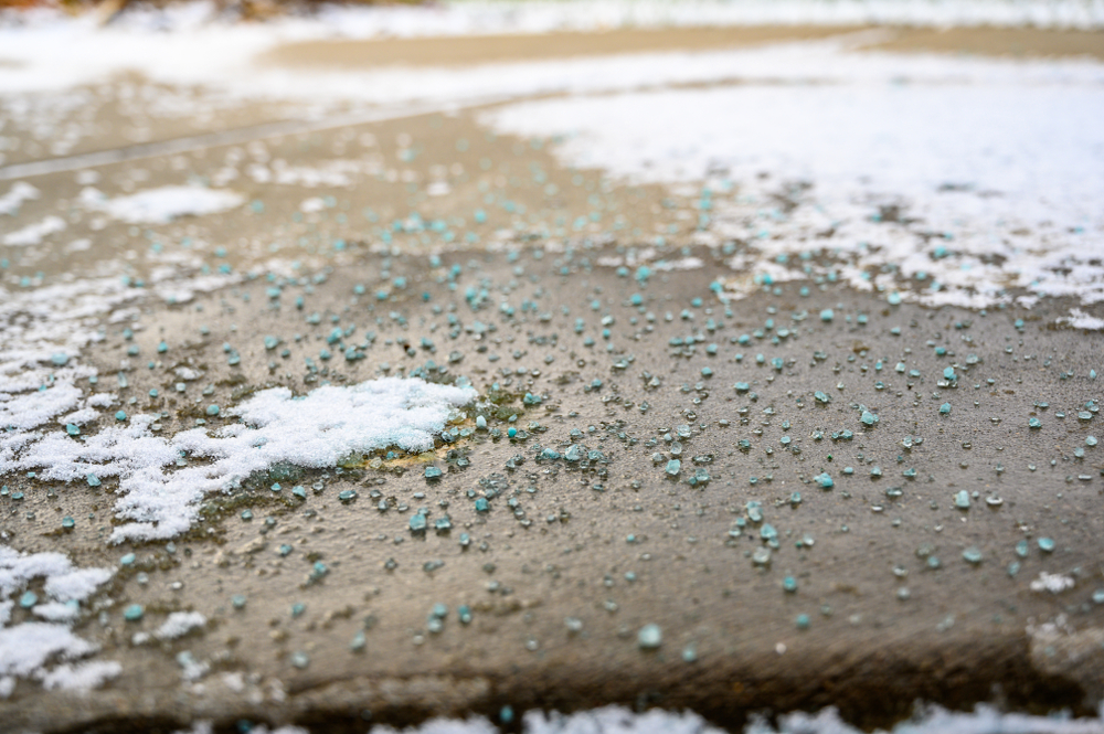 Ground,Level,Closeup,View,Of,Rock,Salt,Ice-melt,On,Concrete
