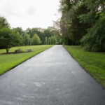 Lush,Green,Grass,Landscaped,Mowed,Lawn,Asphalt,Driveway,Trees,Sky