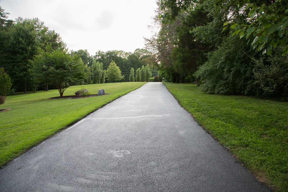 Lush,Green,Grass,Landscaped,Mowed,Lawn,Asphalt,Driveway,Trees,Sky
